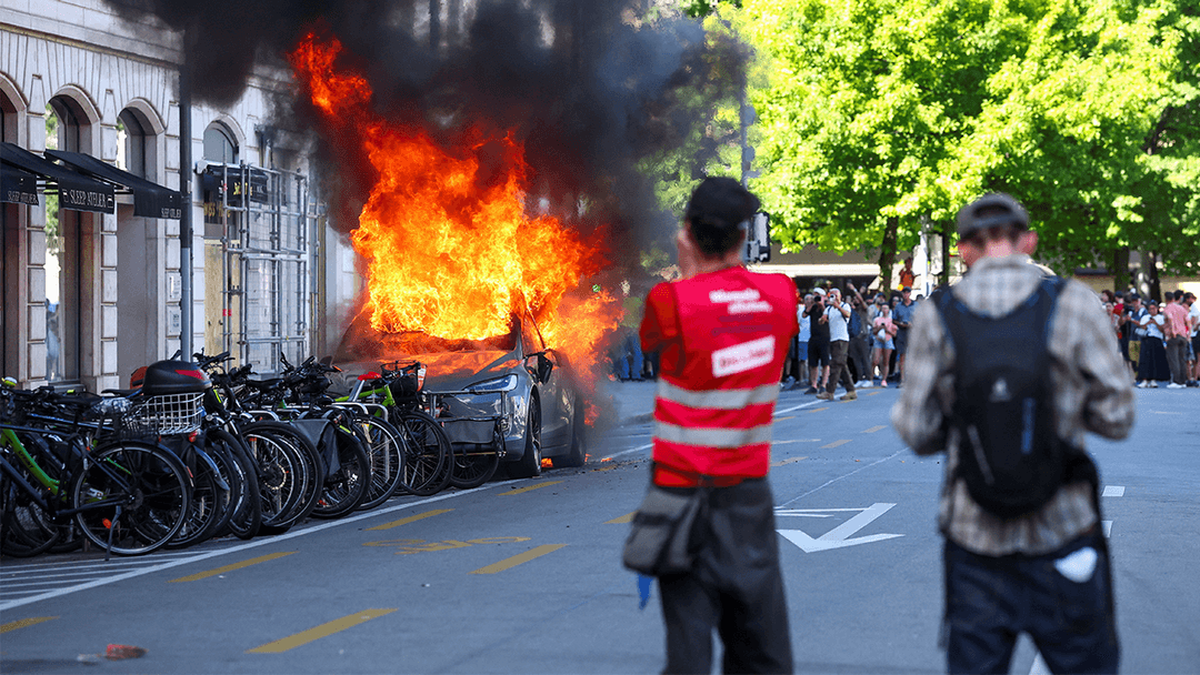 Anti-G7 Protesters Burn Tesla and Smash UN Office Windows in Geneva Clashes